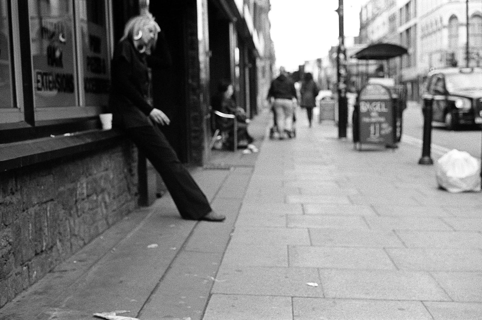 Black-and-white street scene from Manchester